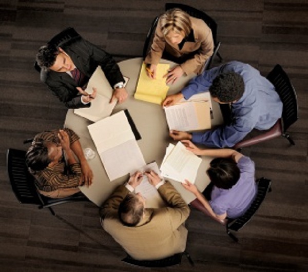 Happy couple signing documents